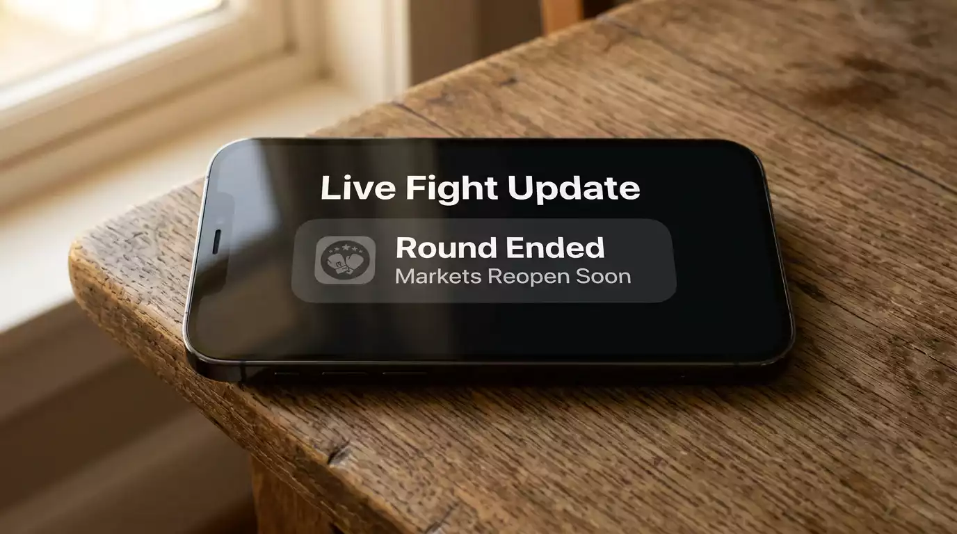 Smartphone lock screen showing a UFC round-end push notification preview from a sportsbook app