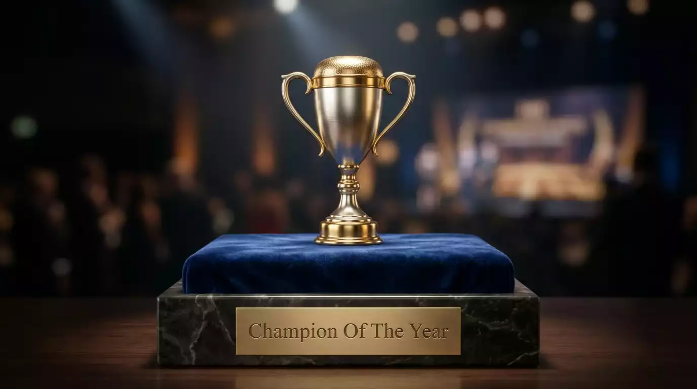 Detail of a UFC year-end performance award trophy displayed on a presentation pedestal